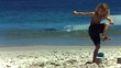 Child crushing a sand castle in slow motion