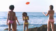 Friends playing frisbee in slow motion