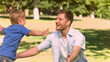Man in slow motion catching his son
