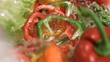 Sliced peppers falling in super slow motion