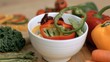 Peppers falling into bowl in super slow motion