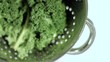 Broccoli in sieve in super slow motion