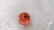 Tomato falling into water in slow motion