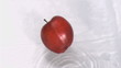 Apple falling into water in super slow motion