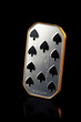 ten of spades. silver coin isolated on black