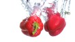 Peppers falling into water in super slow motion