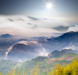 Dramatic clouds with mountain and tree