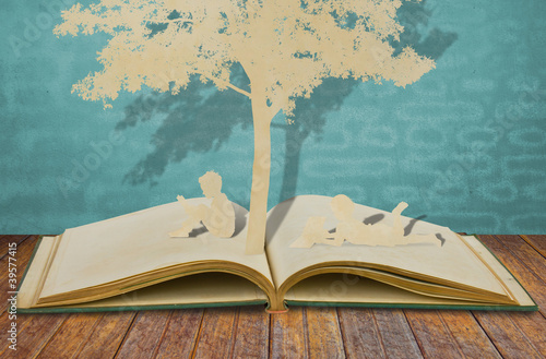 Photo: Paper cut of children read a book Paper cut of children read a book