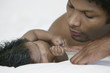 Close up of baby holding father's finger