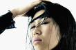 Young woman with her hand on her head