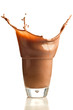 Chocolate splashing into glass