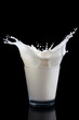 Milk splashing into glass