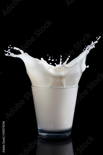Photo: Milk splashing into glass Milk splashing into glass