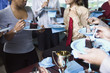 Business people eating cake