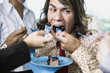 Man being fed cake
