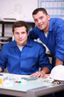 Two warehouse workers taking inventory