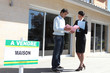 female real estate agent with male client