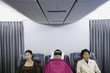 Three passengers on airplane