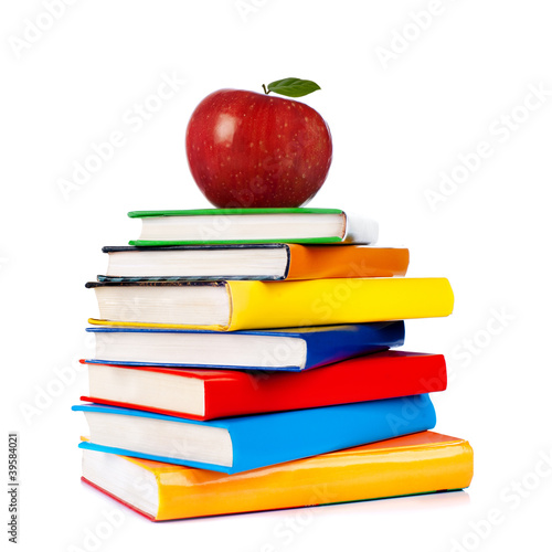 Photo: Books tower with apple isolated on white Books tower with apple isolated on white