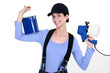 Woman holding paint sprayer