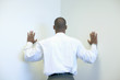 Businessman leaning into corner