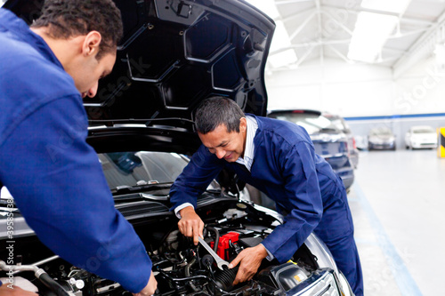 Photo: Mechanics fixing a car Mechanics fixing a car