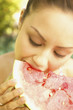 Photo: Young woman eating watermelon Young woman eating watermelon