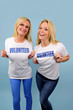 two happy volunteer girls