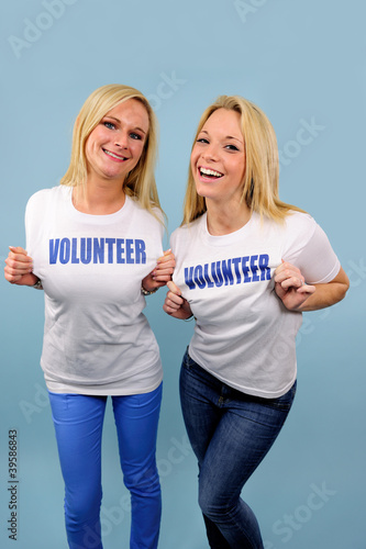 Photo: two happy volunteer girls two happy volunteer girls