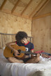 Woman playing guitar