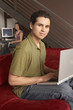 Portrait of man with laptop