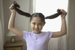 Portrait of girl holding hair up
