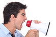 Man screaming into a megaphone