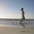 Man jumping rope on beach