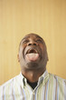 Businessman sticking his tongue out