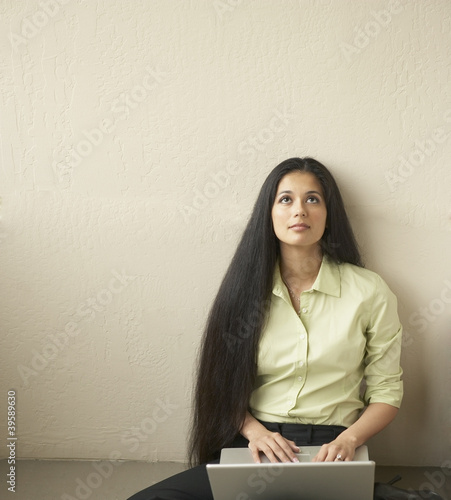 Photo: Businesswoman using laptop Businesswoman using laptop