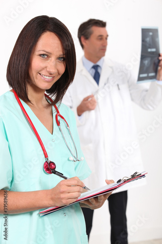 Photo: pretty nurse and doctor in hospital pretty nurse and doctor in hospital