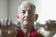 Portrait of elderly man lifting weights