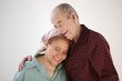 Elderly couple hugging