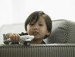 Young boy playing with a model airplane