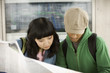 Young couple looking at map
