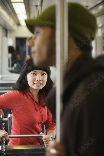 Photo: Young woman looking at young man Young woman looking at young man