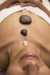 Woman meditating with crystals