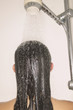 Rear view of woman's head in shower