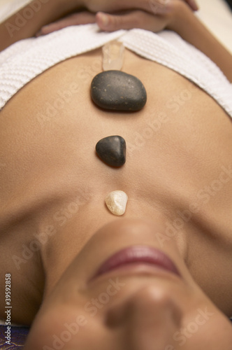 Photo: Woman meditating with crystals Woman meditating with crystals