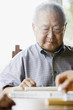 Elderly man playing game