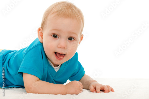 Photo: Cheerful baby boy on the blanket Cheerful baby boy on the blanket