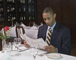 Businessman reading newspaper at restaurant