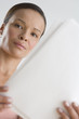 Portrait of woman reading papers