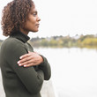 Profile of woman standing by lake